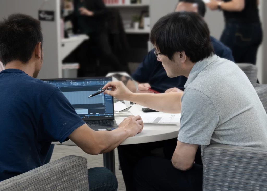 Man Pointing on Laptop Screen