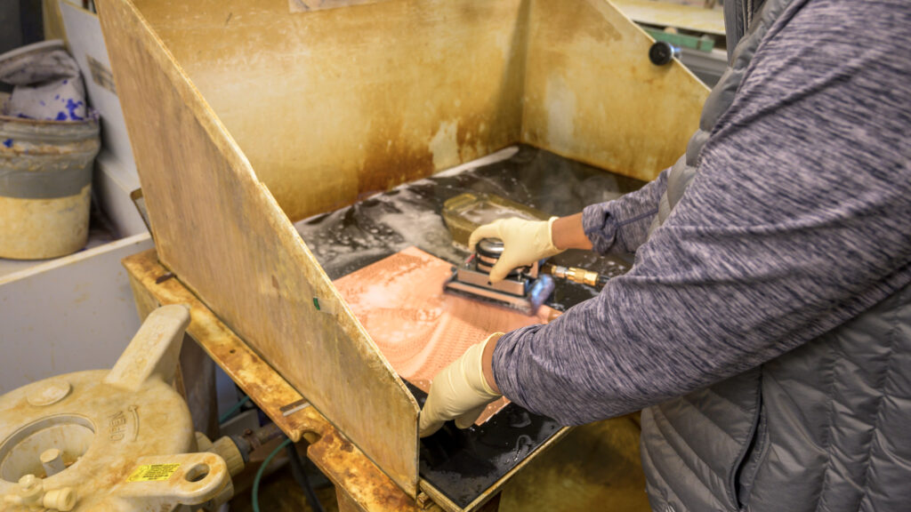 man cleaning a wood