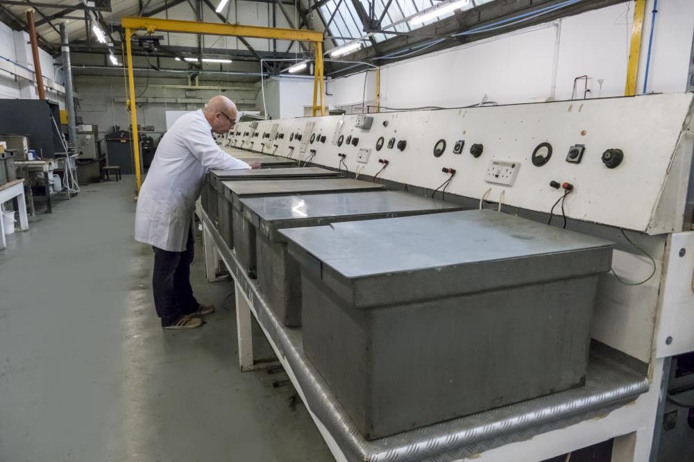 man checking on a machine