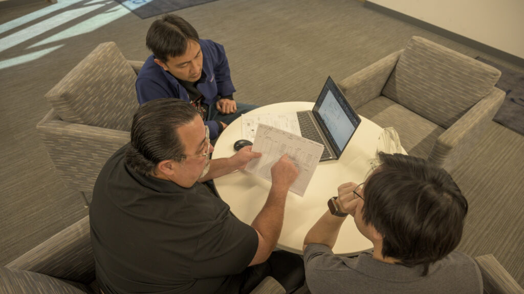 team of E-Fab engineers having a meeting